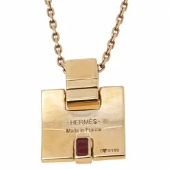 Hermes Eileen Red Enamel Gold Tone Metal Pendant For Women -Deals Hermes Store luxury women hermes used accessories p610453 006