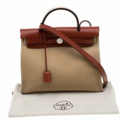 Hermes Trench/Copper Canvas And Leather Herbag Zip 31 Bag For Women 23 Hermes Trench/Copper Canvas And Leather Herbag Zip 31 Bag For Women -Deals Hermes Store luxury women hermes used handbags p186266 007
