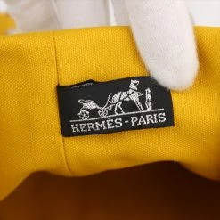 Hermes Yellow Canvas Sac Polochon Drawstring Backpack For Women -Deals Hermes Store luxury women hermes used travel p182147 010